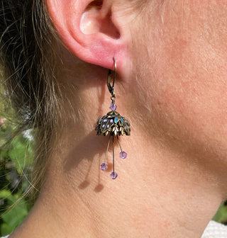 Hand painted lavender and turquoise petals make these beauties really shine in sunlight